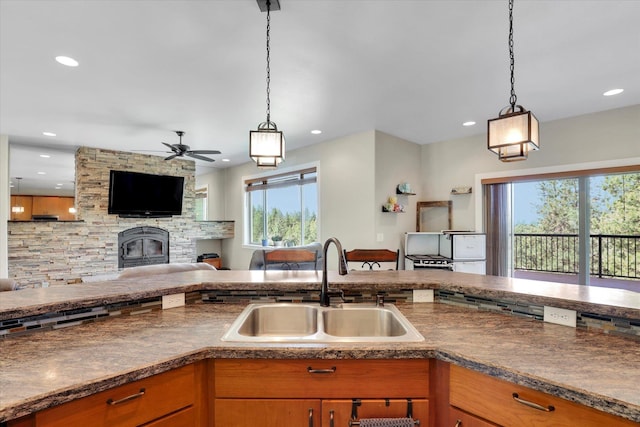 15415 E Timbercrest Ln, Mead, WA 99021 - kitchen with a sink, dark countertops, plenty of natural light, open floor plan, and recessed lighting