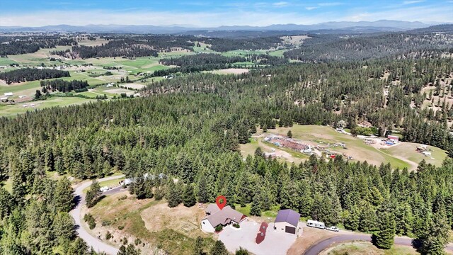 15415 E Timbercrest Ln, Mead, WA 99021 - aerial overview of property's location with mountains and a forest