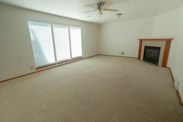 6706 S Moran View St, Spokane, WA 99224 - unfurnished living room with a ceiling fan, a fireplace, and baseboards