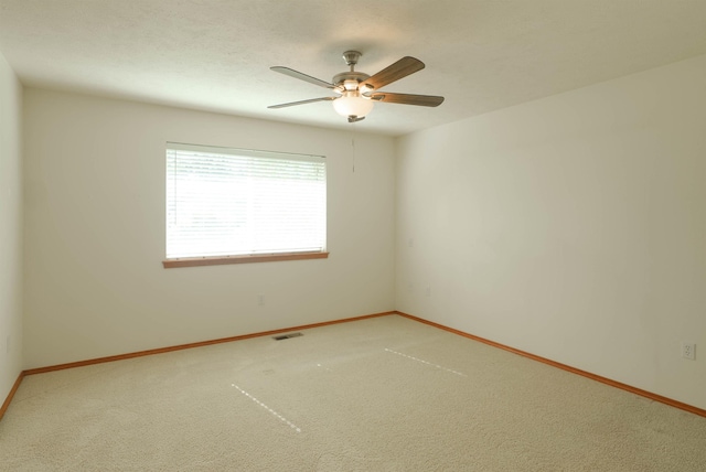 6706 S Moran View St, Spokane, WA 99224 - unfurnished room featuring baseboards, a ceiling fan, and carpet flooring