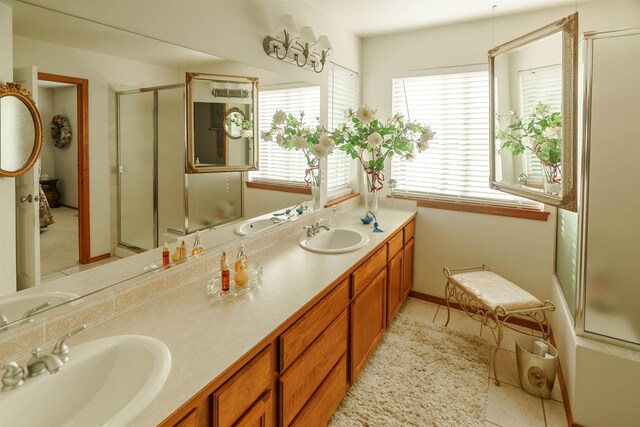 6706 S Moran View St, Spokane, WA 99224 - full bathroom featuring a shower stall, double vanity, and tile patterned floors