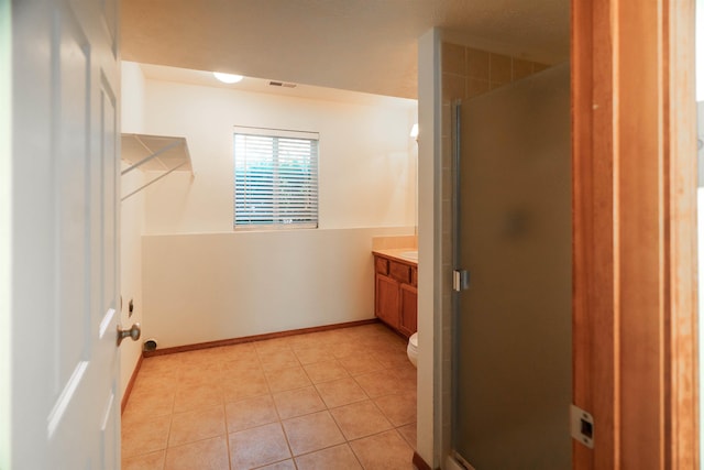 6706 S Moran View St, Spokane, WA 99224 - full bath with vanity, a shower stall, tile patterned flooring, and baseboards