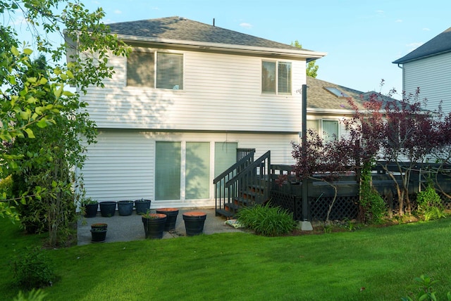6706 S Moran View St, Spokane, WA 99224 - back of property featuring roof with shingles, a yard, and a wooden deck