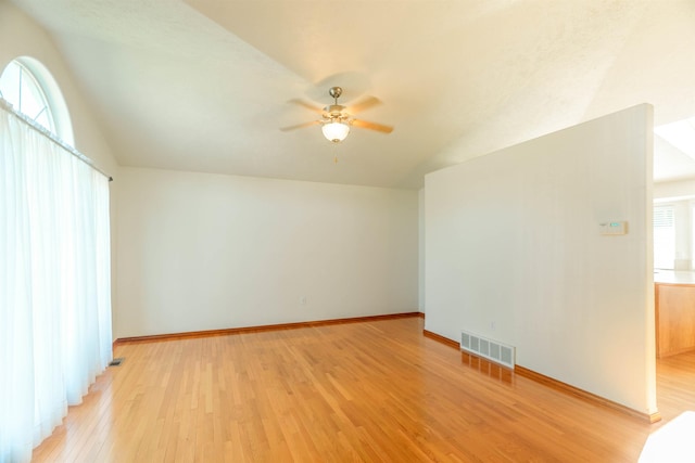 6706 S Moran View St, Spokane, WA 99224 - additional living space with lofted ceiling, light wood-style flooring, a ceiling fan, plenty of natural light, and baseboards