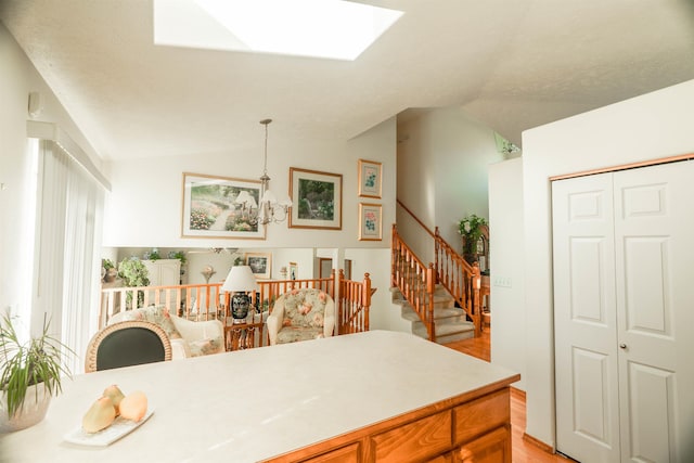 6706 S Moran View St, Spokane, WA 99224 - dining area featuring vaulted ceiling, light wood finished floors, a skylight, and stairway