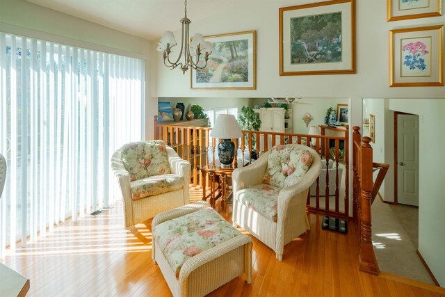 6706 S Moran View St, Spokane, WA 99224 - sitting room with a chandelier, wood-type flooring, and an upstairs landing