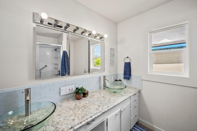 2603 E Wellesley Ave, Spokane, WA 99217 - full bath featuring double vanity, tasteful backsplash, and a shower