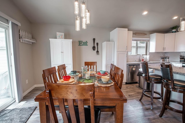 3414 N Lee St, Spokane, WA 99207 - dining space with wood finished floors, recessed lighting, baseboards, and a chandelier