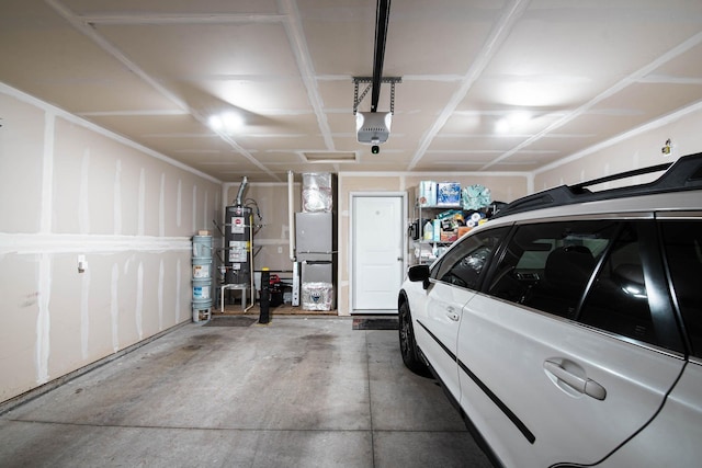 3414 N Lee St, Spokane, WA 99207 - garage featuring a garage door opener, water heater, and fridge