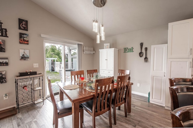 3414 N Lee St, Spokane, WA 99207 - dining space featuring light wood-type flooring, vaulted ceiling, and baseboards