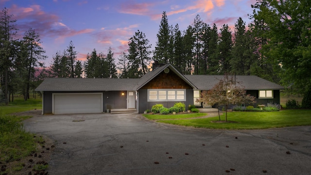 12411 E Gibbs Rd, Mica, WA 99023 - ranch-style house with driveway, a garage, and a front lawn