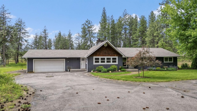 12411 E Gibbs Rd, Mica, WA 99023 - single story home with asphalt driveway, a garage, a chimney, a front yard, and roof with shingles
