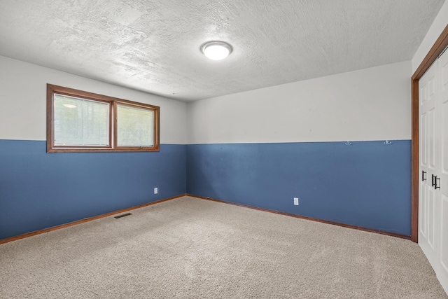 12411 E Gibbs Rd, Mica, WA 99023 - carpeted spare room featuring a textured ceiling and baseboards