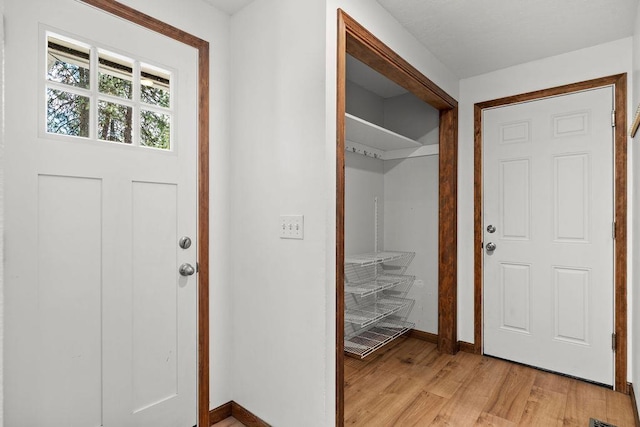 12411 E Gibbs Rd, Mica, WA 99023 - entryway featuring baseboards and light wood finished floors