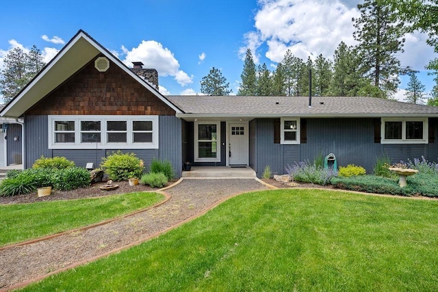 12411 E Gibbs Rd, Mica, WA 99023 - single story home with a chimney and a front yard