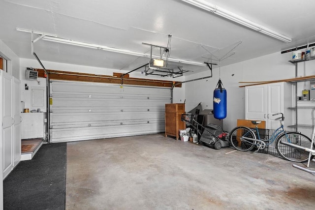 12411 E Gibbs Rd, Mica, WA 99023 - garage with a garage door opener and a heating unit
