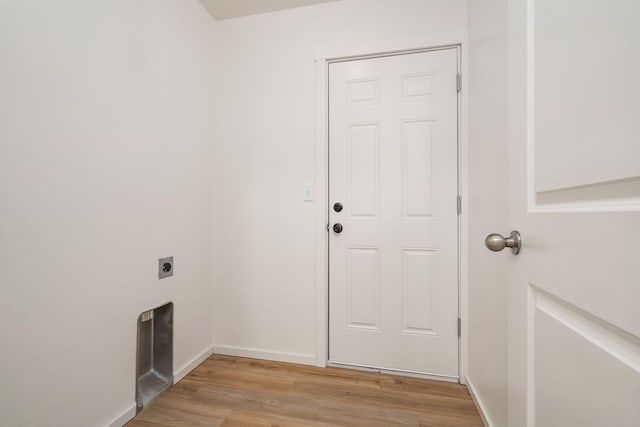 10214 W January Ct, Cheney, WA 99004 - laundry area featuring hookup for an electric dryer, light wood-style flooring, and baseboards