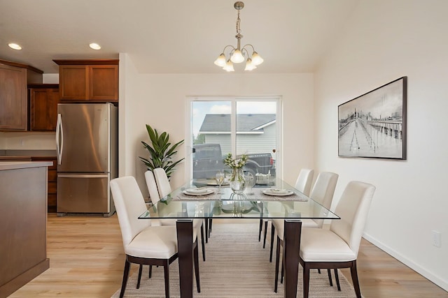 10214 W January Ct, Cheney, WA 99004 - dining area with light wood-type flooring, a chandelier, recessed lighting, and baseboards