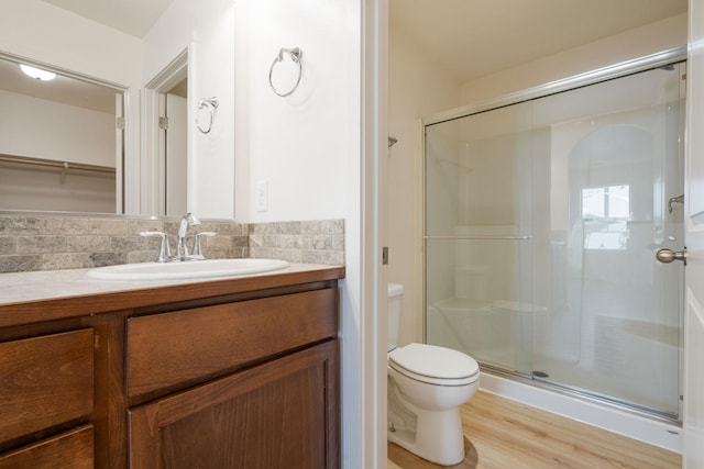 10214 W January Ct, Cheney, WA 99004 - bathroom featuring a stall shower, vanity, toilet, and wood finished floors