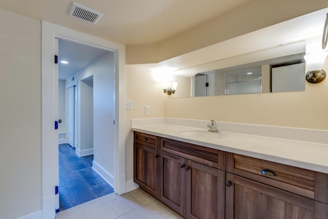 523 S Hatch St, Spokane, WA 99202 - bathroom featuring vanity, tile patterned flooring, and baseboards