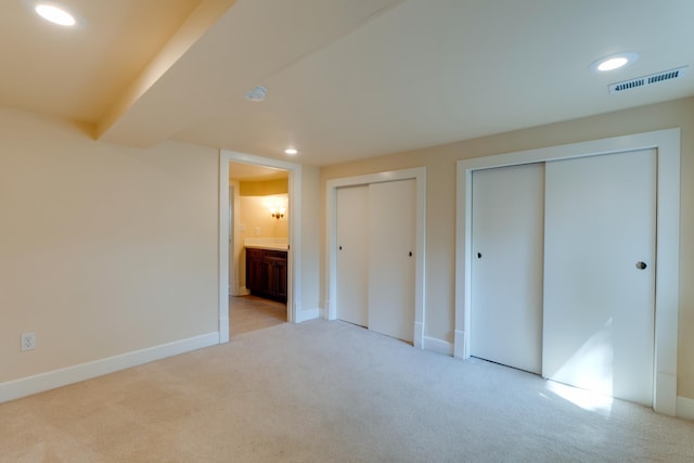 523 S Hatch St, Spokane, WA 99202 - unfurnished bedroom with multiple closets, carpet flooring, recessed lighting, baseboards, and ensuite bathroom