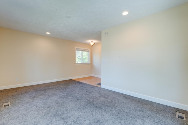 523 S Hatch St, Spokane, WA 99202 - empty room featuring light carpet, baseboards, and recessed lighting