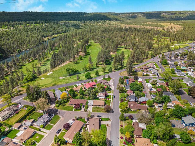 3342 W Riverview Dr, Spokane, WA 99205 - aerial overview of property's location with a forest and nearby suburban area