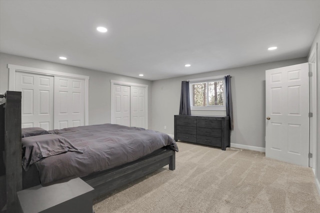 8428 N Susan Ct, Spokane, WA 99208 - bedroom featuring recessed lighting, two closets, light colored carpet, and baseboards