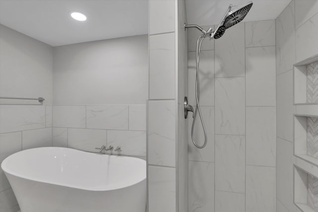 8428 N Susan Ct, Spokane, WA 99208 - bathroom featuring a soaking tub, tiled shower, tile walls, and recessed lighting