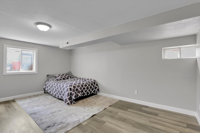 8428 N Susan Ct, Spokane, WA 99208 - bedroom featuring baseboards and wood finished floors