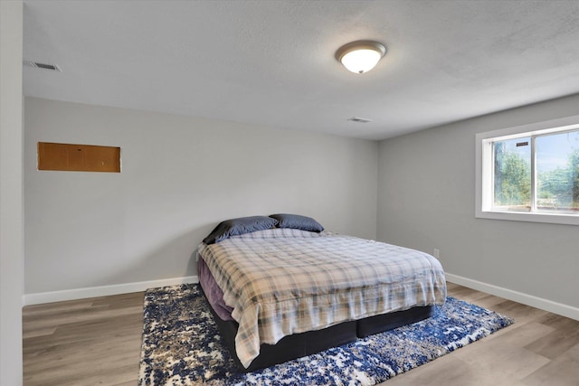 8428 N Susan Ct, Spokane, WA 99208 - bedroom with baseboards and wood finished floors