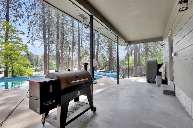 8428 N Susan Ct, Spokane, WA 99208 - sunroom with plenty of natural light and view of wooded area
