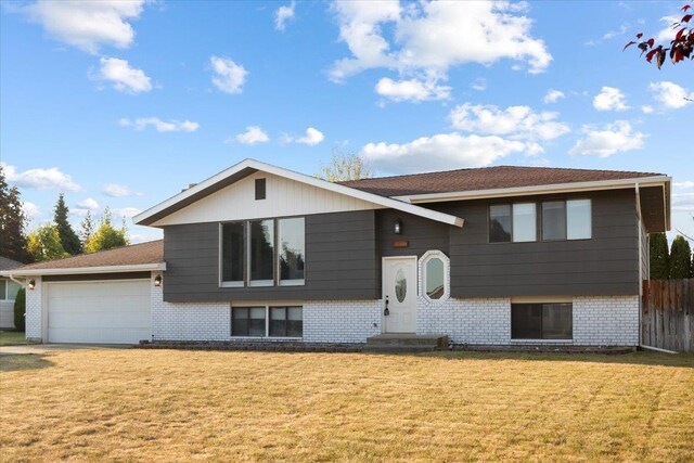 6106 W Kittitas Ct, Spokane, WA 99208 - raised ranch with brick siding and an attached garage