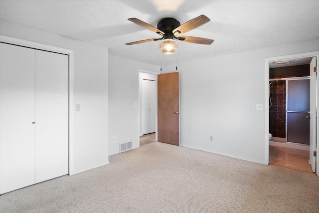 6106 W Kittitas Ct, Spokane, WA 99208 - unfurnished bedroom featuring a closet, carpet flooring, and ceiling fan