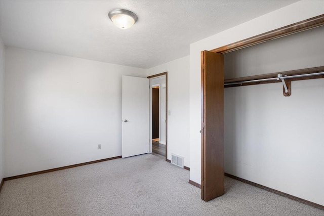 6106 W Kittitas Ct, Spokane, WA 99208 - unfurnished bedroom featuring carpet flooring, a closet, and baseboards