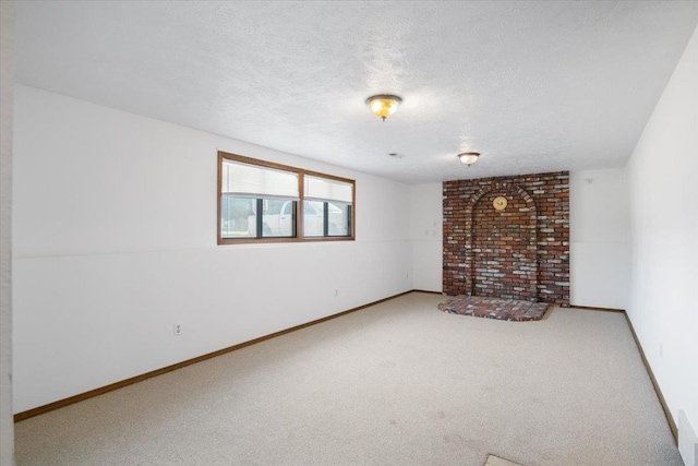 6106 W Kittitas Ct, Spokane, WA 99208 - carpeted empty room featuring a textured ceiling and baseboards