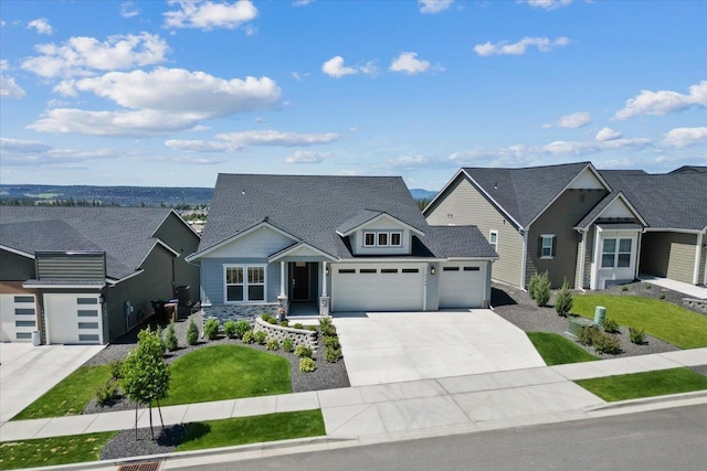4756 W Lex Ave, Spokane, WA 99208 - craftsman-style home featuring an attached garage, driveway, stone siding, a front yard, and a shingled roof