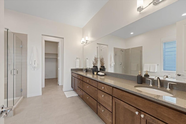 4756 W Lex Ave, Spokane, WA 99208 - full bath with a stall shower, double vanity, tile patterned floors, and a walk in closet