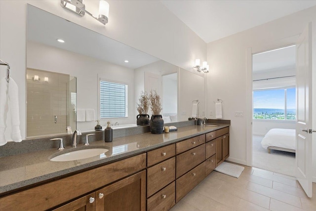 4756 W Lex Ave, Spokane, WA 99208 - ensuite bathroom featuring double vanity, a shower stall, tile patterned floors, and recessed lighting