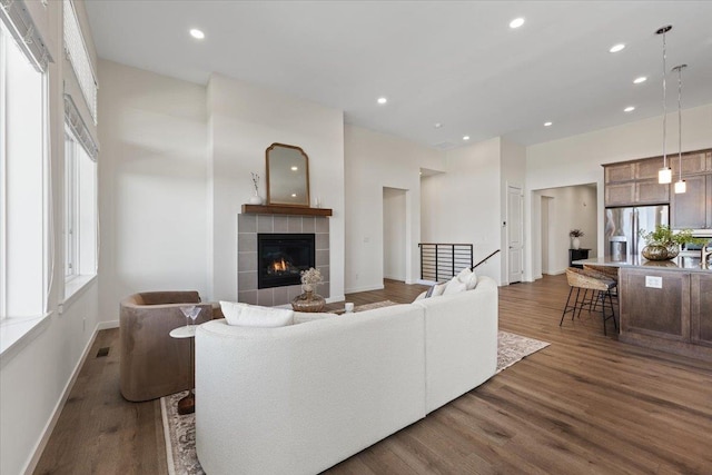 4756 W Lex Ave, Spokane, WA 99208 - living area with dark wood-style flooring, a fireplace, baseboards, and recessed lighting