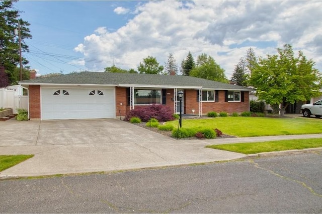 5516 N Fleming St, Spokane, WA 99205 - single story home with driveway, an attached garage, brick siding, and a chimney