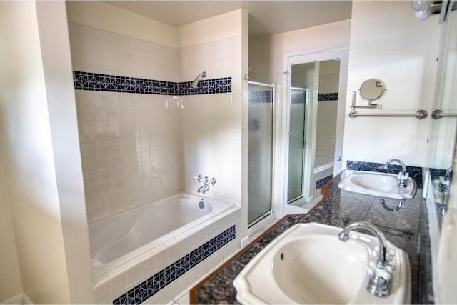 5516 N Fleming St, Spokane, WA 99205 - bathroom featuring tiled shower, tiled tub, and double vanity