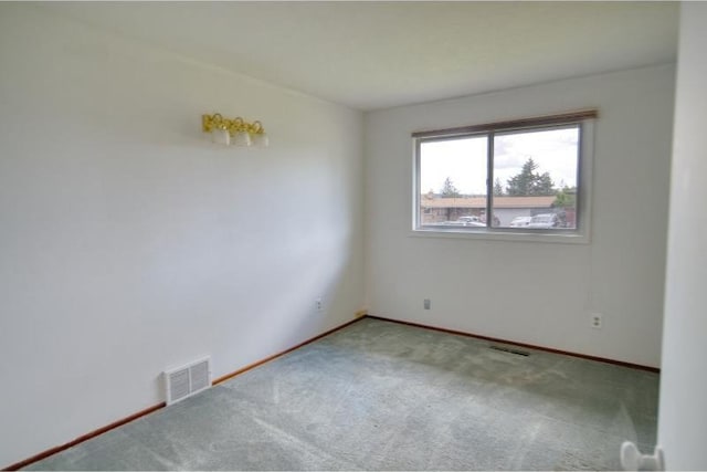 5516 N Fleming St, Spokane, WA 99205 - empty room with carpet floors and baseboards