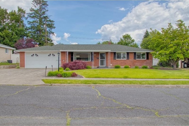 5516 N Fleming St, Spokane, WA 99205 - ranch-style home with concrete driveway, a front yard, a garage, and brick siding