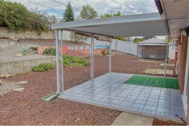 5516 N Fleming St, Spokane, WA 99205 - fenced backyard featuring a patio area