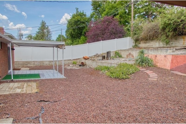 5516 N Fleming St, Spokane, WA 99205 - fenced backyard with a patio area