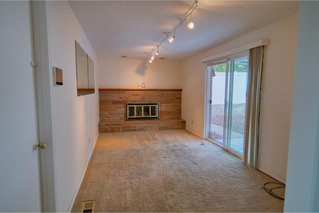 5516 N Fleming St, Spokane, WA 99205 - unfurnished living room with carpet flooring, a fireplace, and track lighting