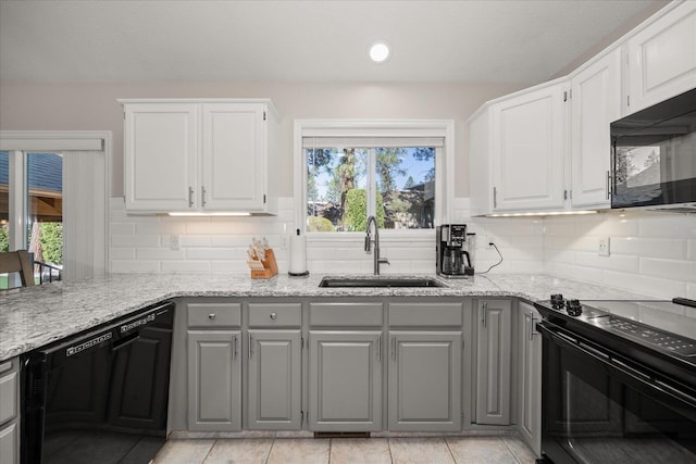 1216 W Candlewood Ct, Spokane, WA 99218 - kitchen with black appliances, a sink, gray cabinets, and healthy amount of natural light