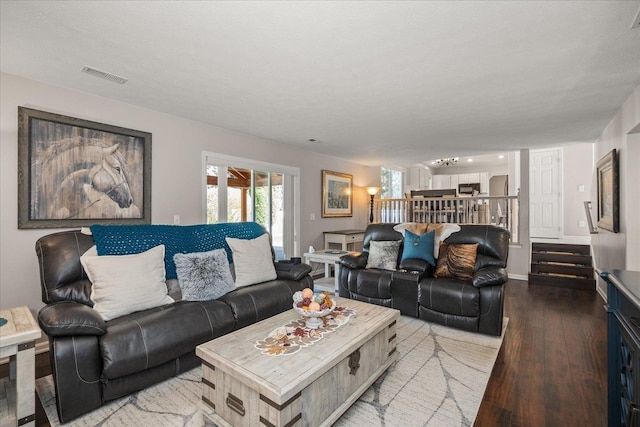 1216 W Candlewood Ct, Spokane, WA 99218 - living room featuring wood finished floors and stairway