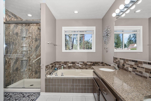 1216 W Candlewood Ct, Spokane, WA 99218 - full bath featuring vanity, a garden tub, a stall shower, and tasteful backsplash